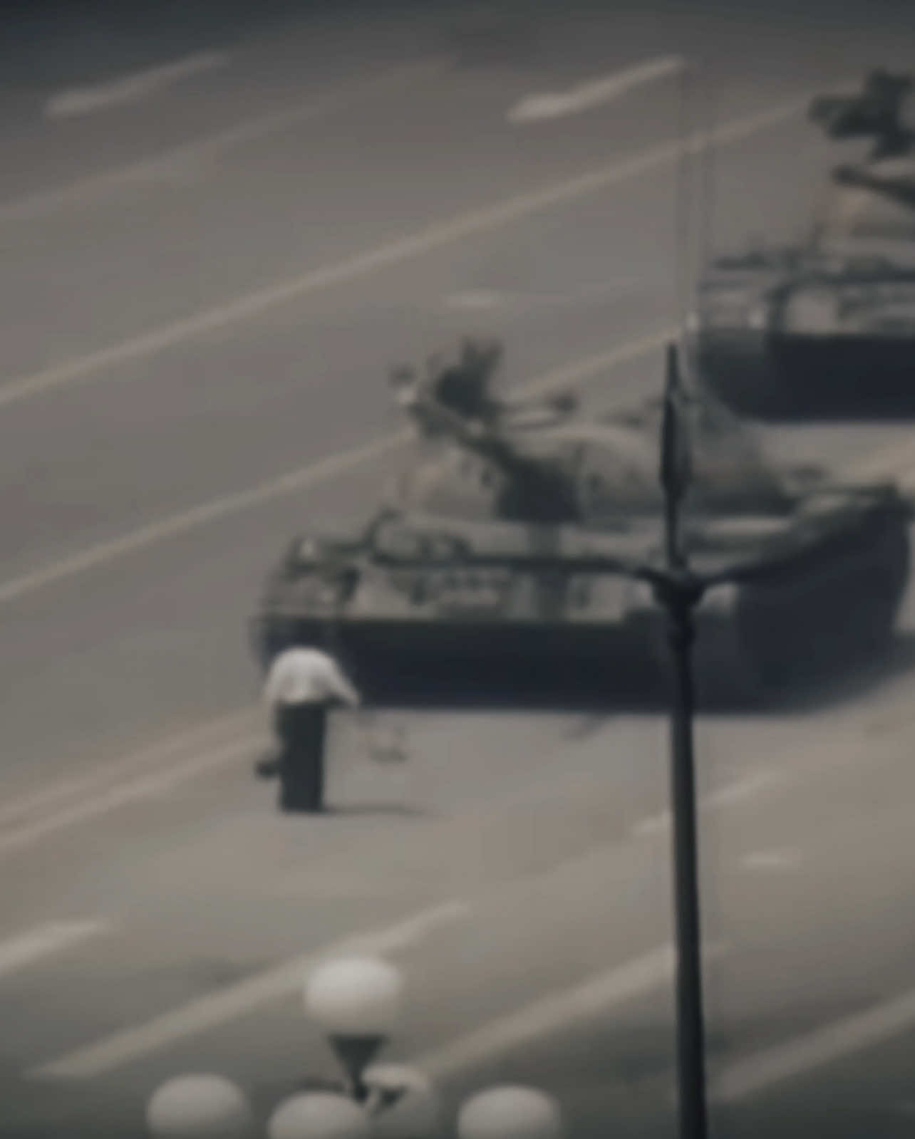 Tank Man is the nickname given to an unidentified man who stood alone in front of a column of Chinese tanks on June 5, 1989, on Chang’an Avenue in Beijing, the day after the Tiananmen Square Massacre. His act has become a global symbol of peaceful resistance against oppression. Quick Context: • Between April and June 1989, pro-democracy protests in Tiananmen Square were violently suppressed by the Chinese military, resulting in hundreds or thousands of deaths. • On June 5, this man blocked a l